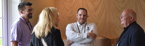 Photo of a group of attendees conversing